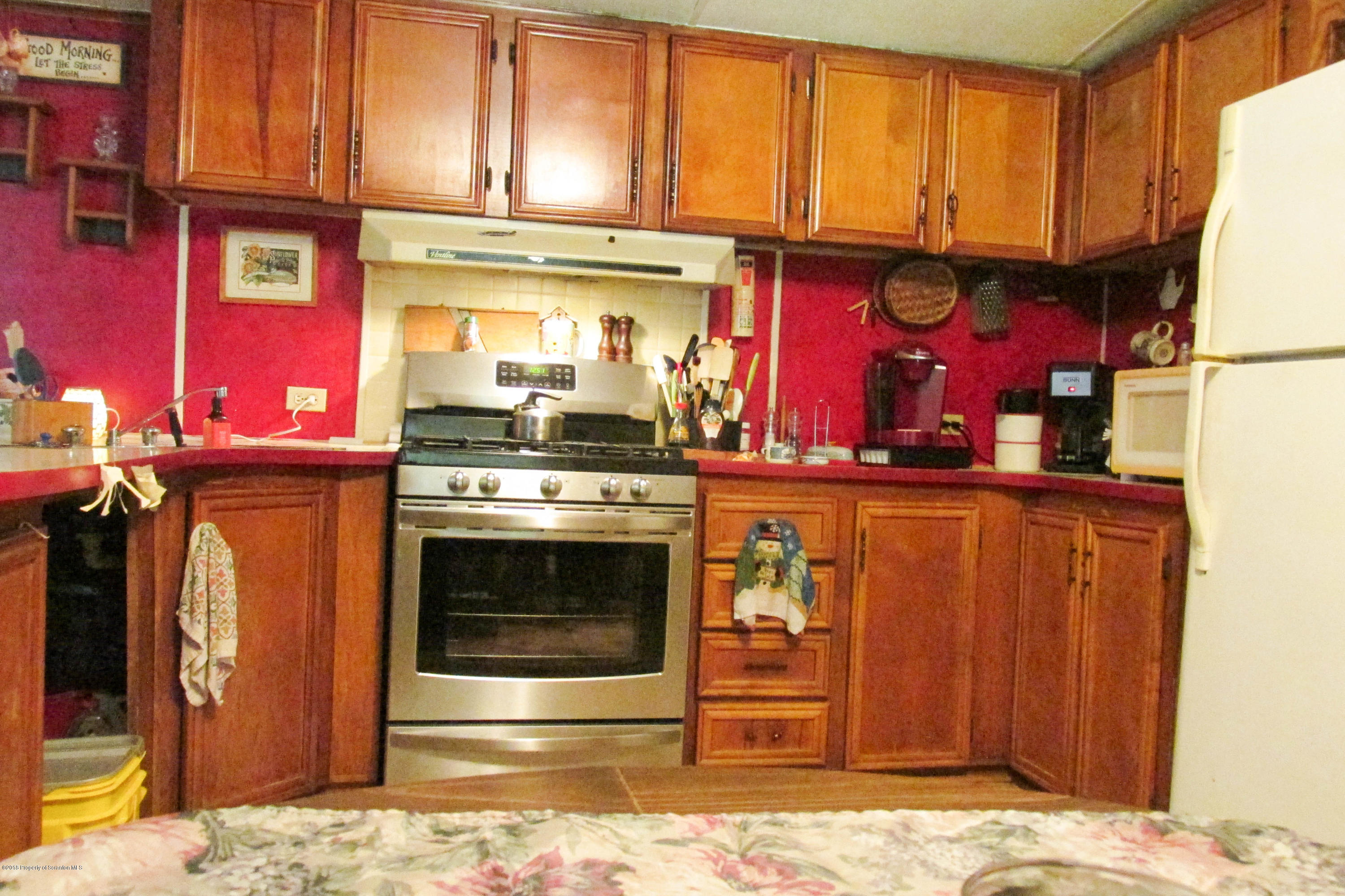 2309 White Pond Road Meshoppen, PA 18630 - Photo 5 of 21 a kitchen with stainless steel appliances granite countertop a stove top oven
