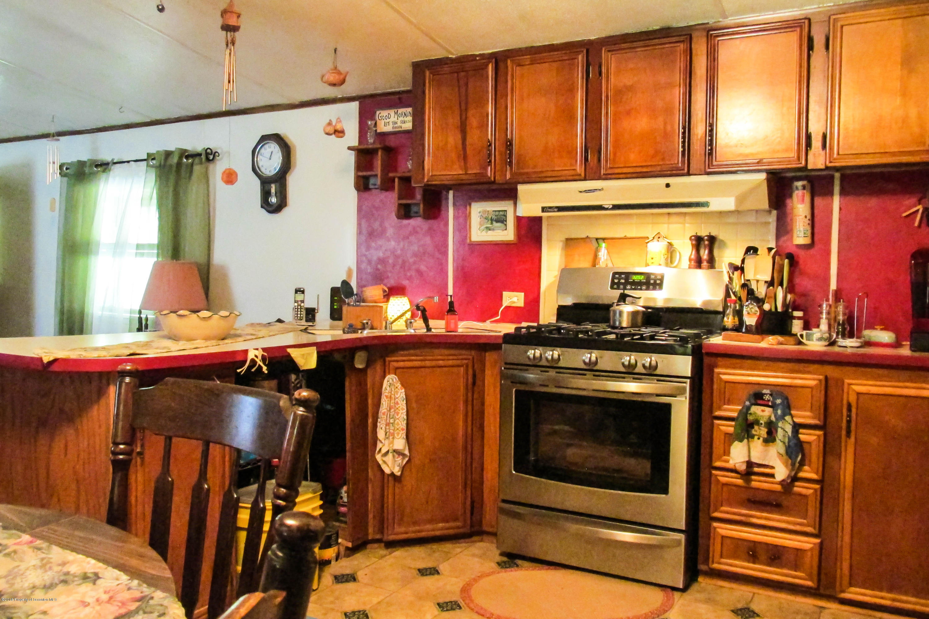 2309 White Pond Road Meshoppen, PA 18630 - Photo 6 of 21 a kitchen with stainless steel appliances granite countertop a stove and a sink