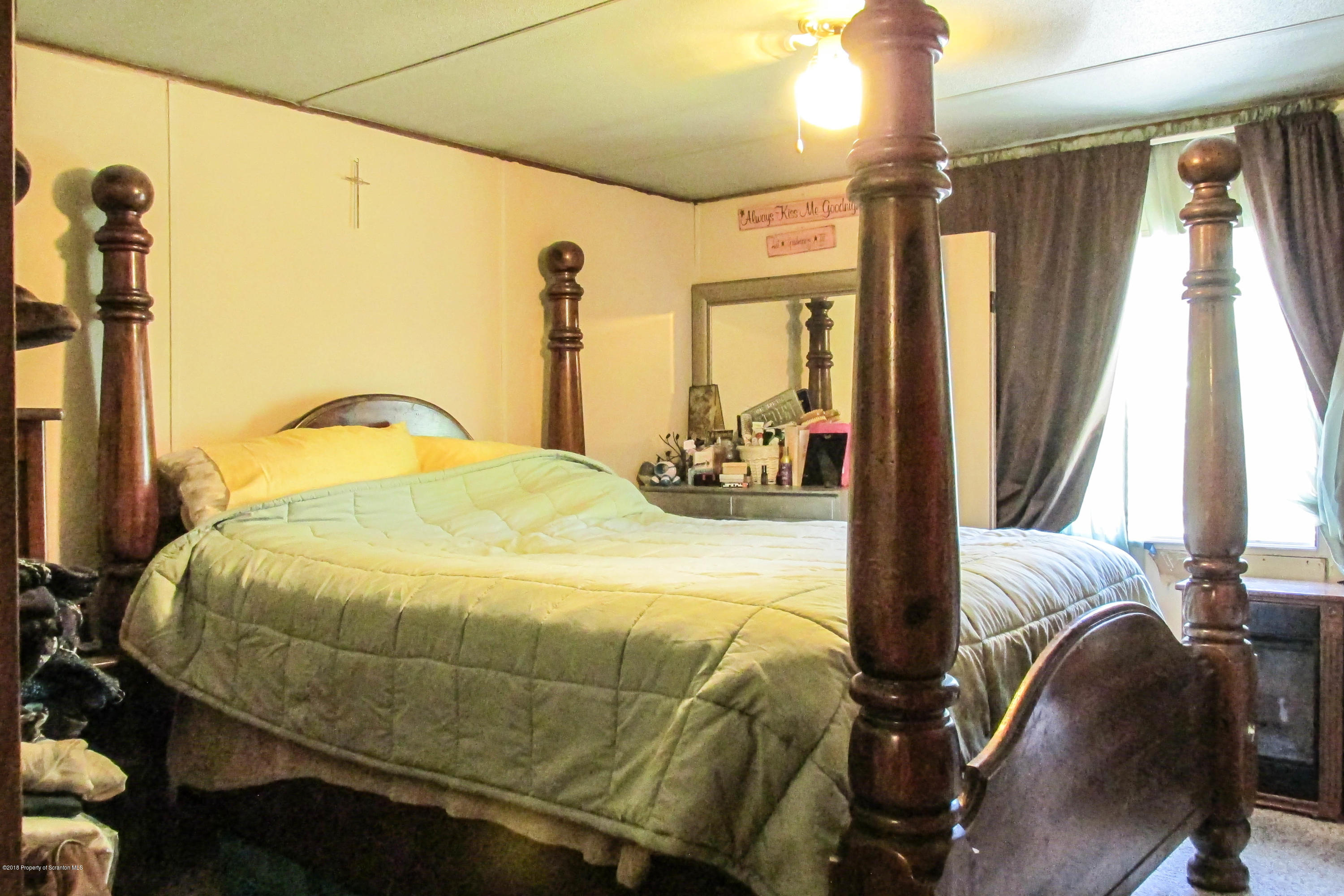 2309 White Pond Road Meshoppen, PA 18630 - Photo 8 of 21 a bedroom with a bed and wooden floor