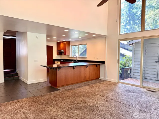 a view of kitchen with cabinets