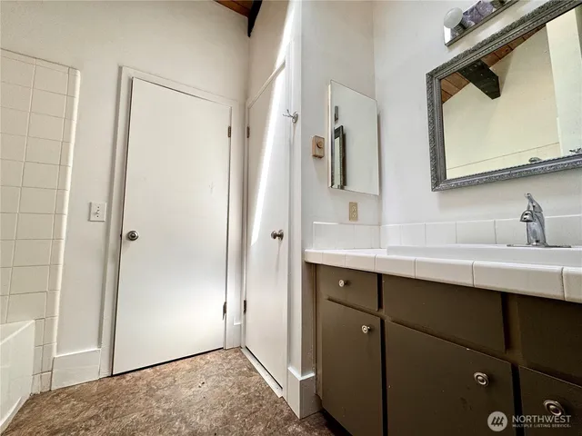 a bathroom with a sink and a mirror
