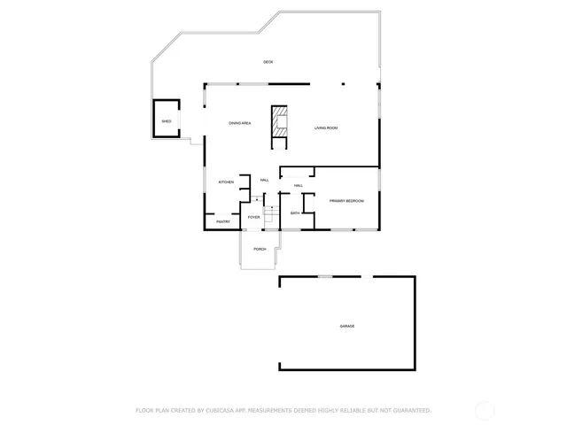 a aerial view of a house with a yard and large tree