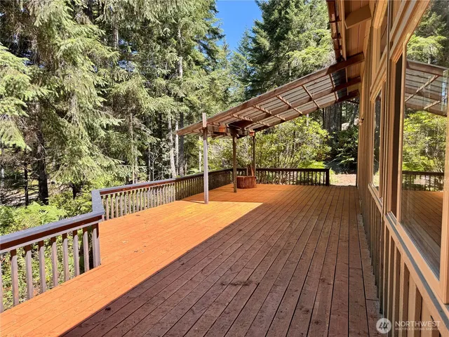 a view of balcony with wooden floor