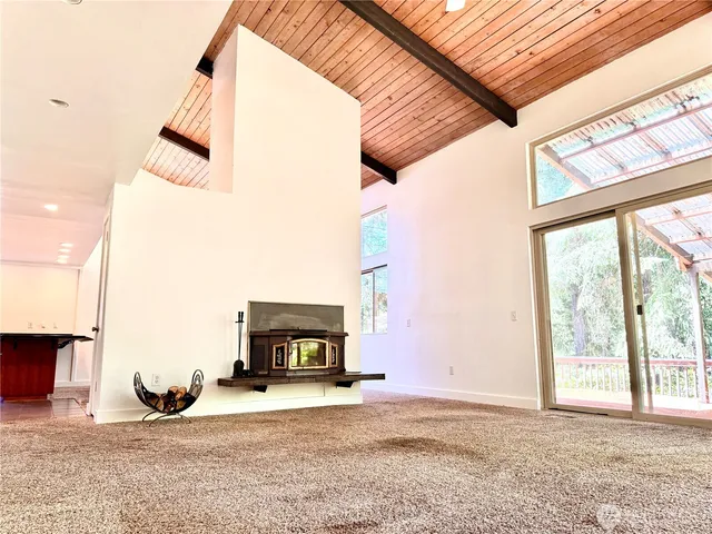 a view of a livingroom with furniture and a fireplace