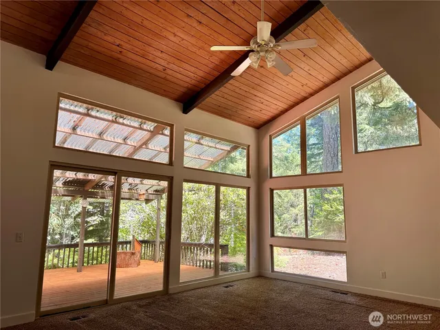 a view of an empty room with a balcony