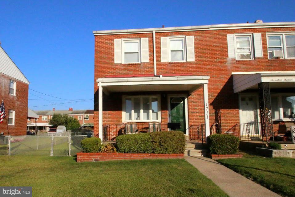 1711 Stokesley Road Baltimore, MD 21222 - Photo 1 of 30 a front view of a house with a yard