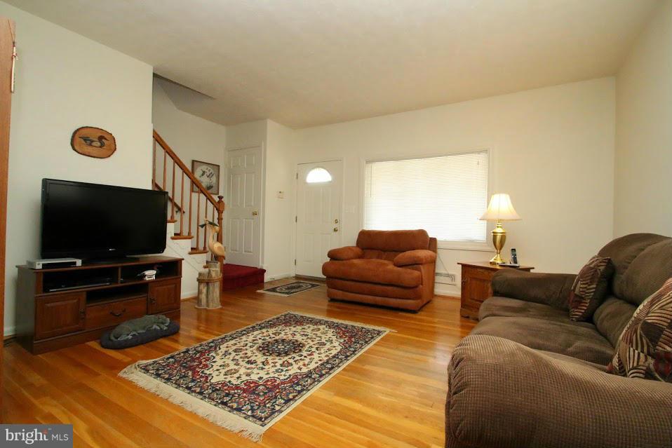 1711 Stokesley Road Baltimore, MD 21222 - Photo 2 of 30 a living room with furniture and a flat screen tv