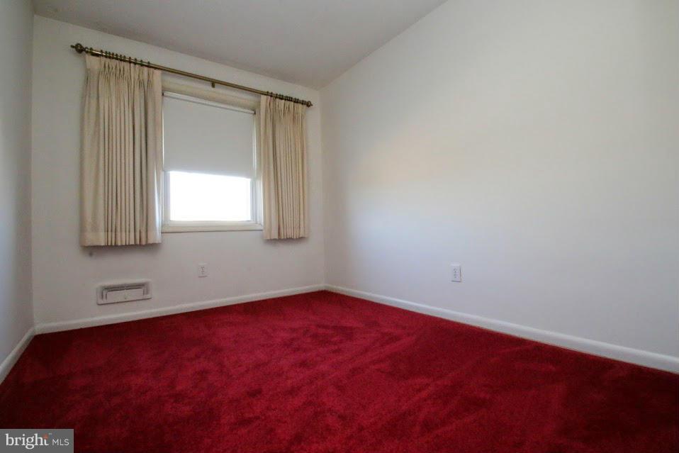 1711 Stokesley Road Baltimore, MD 21222 - Photo 13 of 30 an empty room with a window