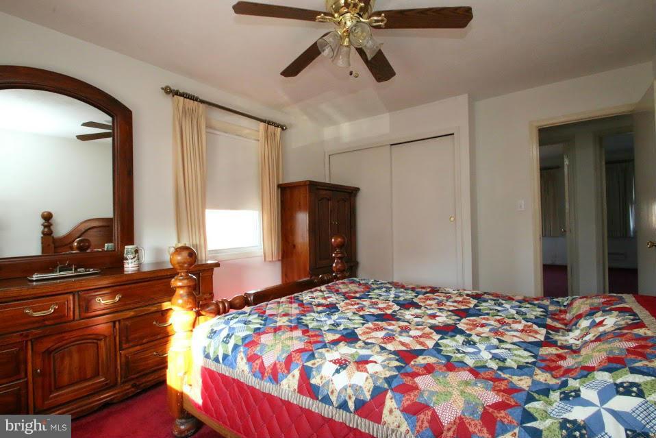 1711 Stokesley Road Baltimore, MD 21222 - Photo 17 of 30 a bedroom with a bed and a dresser