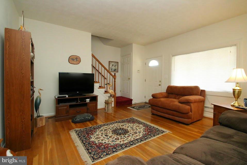1711 Stokesley Road Baltimore, MD 21222 - Photo 3 of 30 a living room with furniture and a flat screen tv