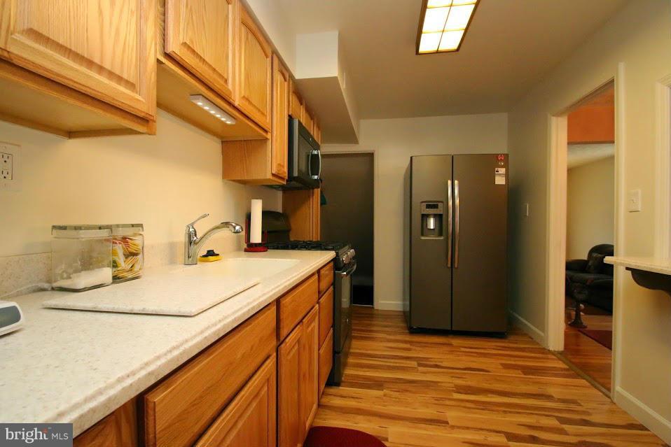 1711 Stokesley Road Baltimore, MD 21222 - Photo 9 of 30 a bathroom with a sink and a mirror