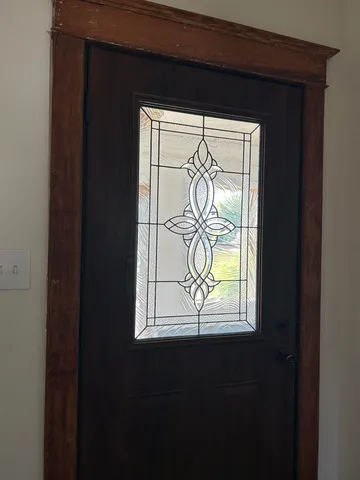 a view of a livingroom with wooden floor and a window