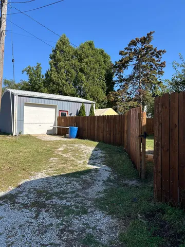 a view of a backyard with trees