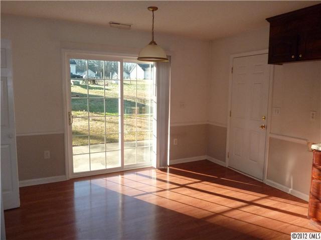 1105 Crescent Way Wingate, NC 28174 - Photo 4 of 11 a view of empty room with wooden floor and fan