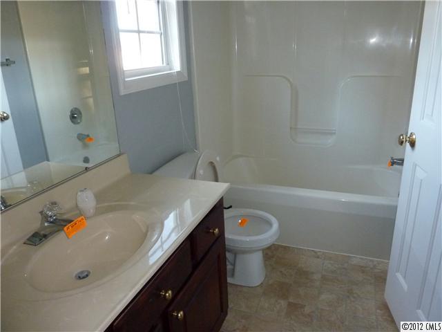1105 Crescent Way Wingate, NC 28174 - Photo 6 of 11 a bathroom with a sink a toilet and bathtub
