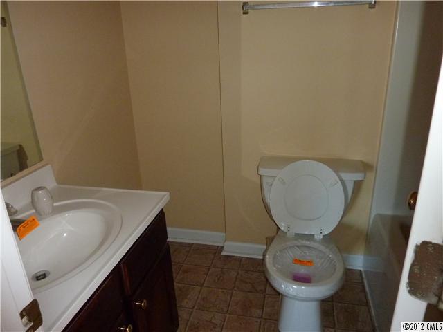 1105 Crescent Way Wingate, NC 28174 - Photo 9 of 11 a bathroom with a sink and a mirror