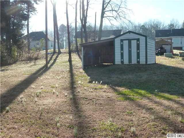 1105 Crescent Way Wingate, NC 28174 - Photo 10 of 11 a view of a house with a yard covered in snow