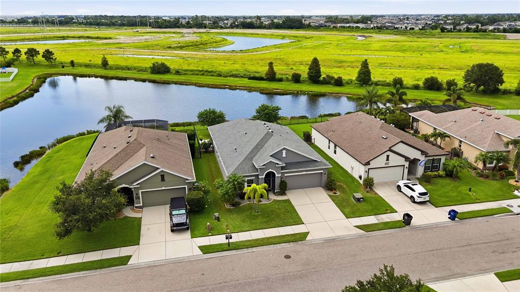 10920 79th Street East Parrish, FL 34219 - Photo 55 of 73 an aerial view of residential houses with outdoor space and ocean view