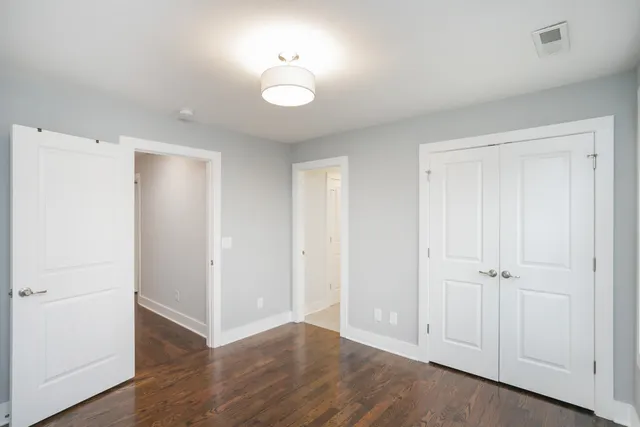 a bathroom with a toilet a sink and a window