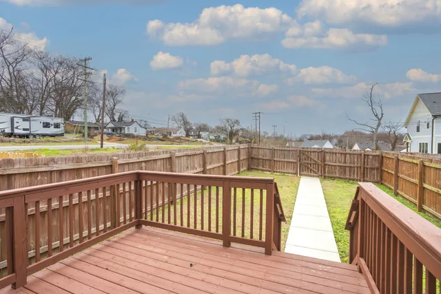 a view of a balcony with wooden floor