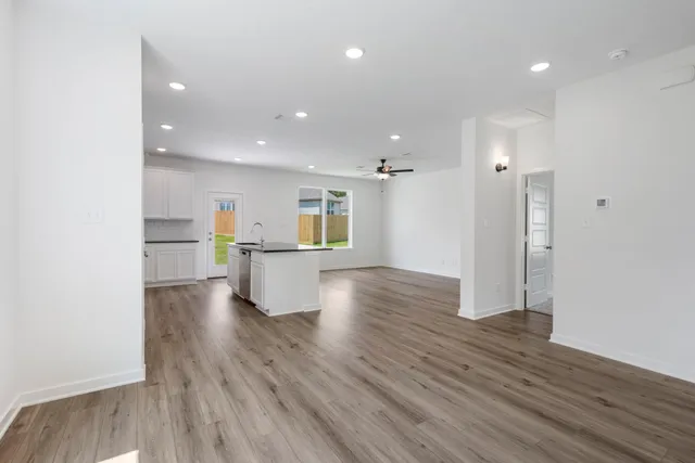 a view of kitchen with wooden floor and window