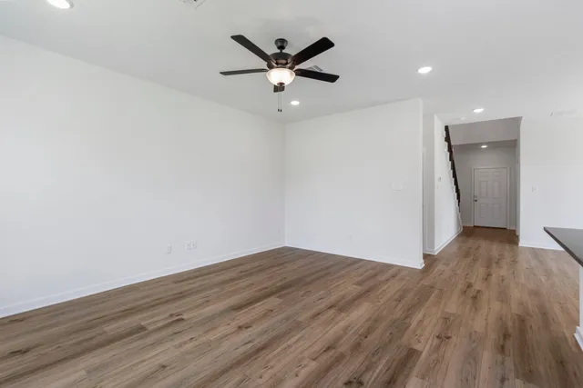 a large kitchen with stainless steel appliances granite countertop a stove a sink and a microwave