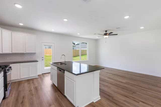 a kitchen with a sink and a refrigerator