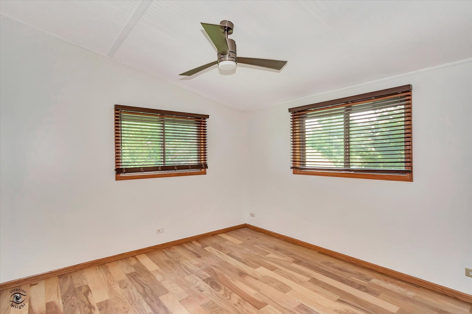 944 East County Line Road Grant Park, IL 60940 - Photo 25 of 46 a view of empty room with wooden floor and fan