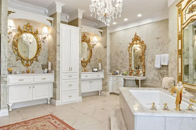 a bathroom with a tub sink and mirror