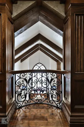 an aerial view of residential houses with outdoor space and parking