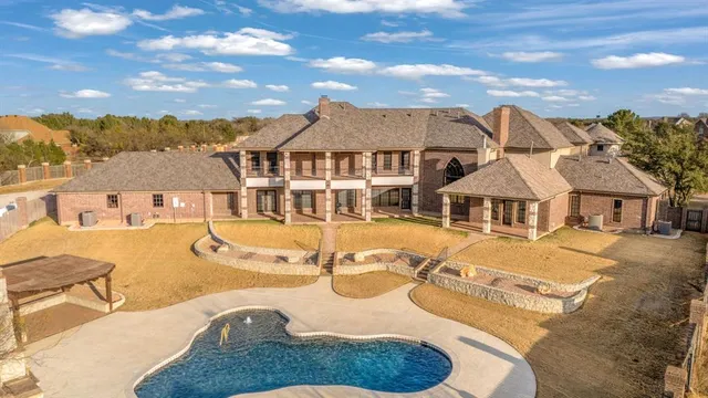 a view of a swimming pool with a lounge chair