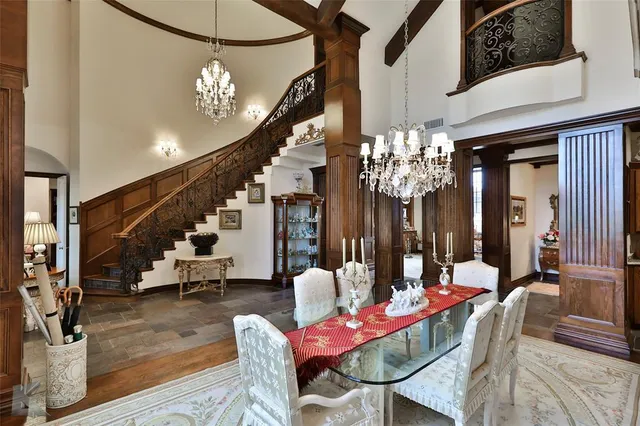 a view of a dining room with furniture and chandelier