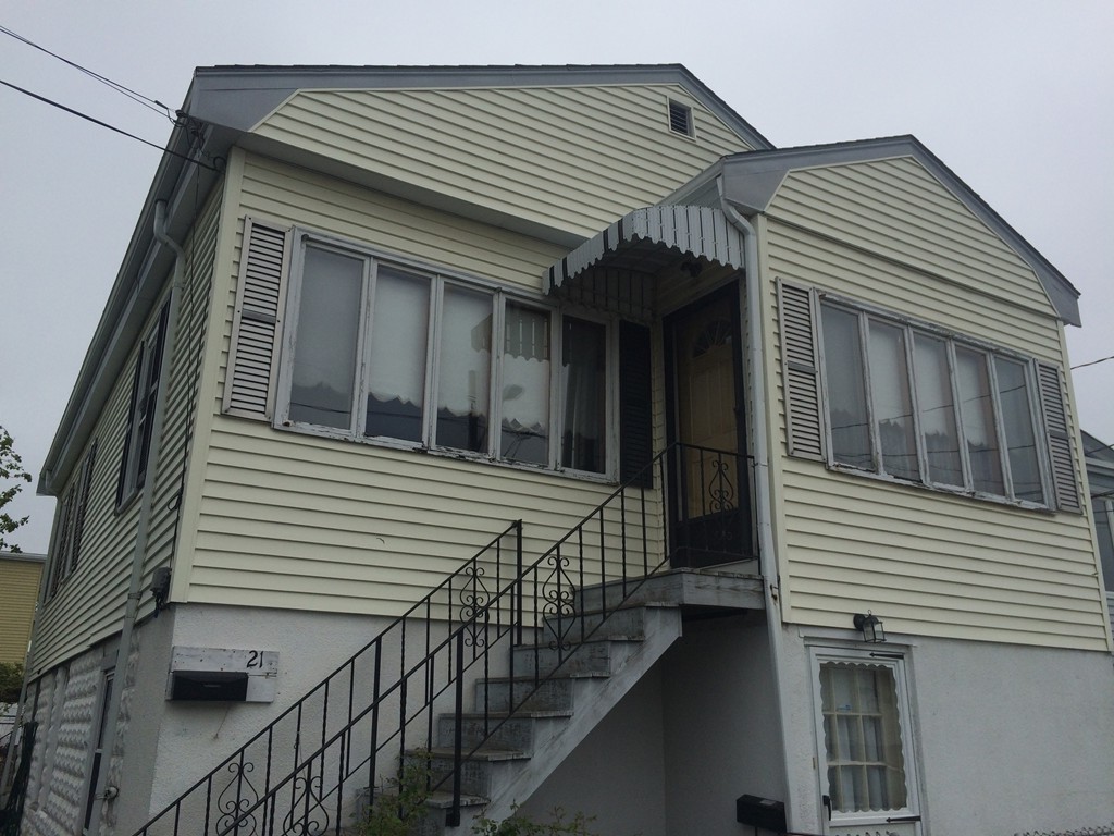 a view of a house with iron stairs