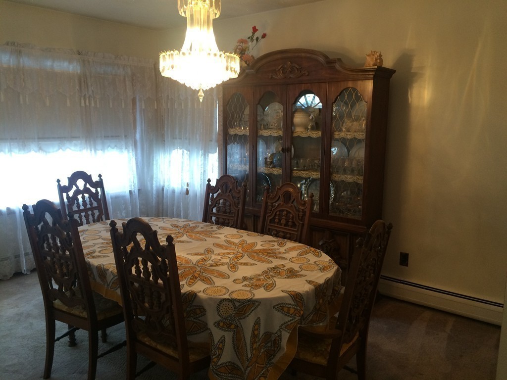 21 Beach Road Revere, MA 02151 - Photo 20 of 21 a view of a dining room with furniture and chandelier