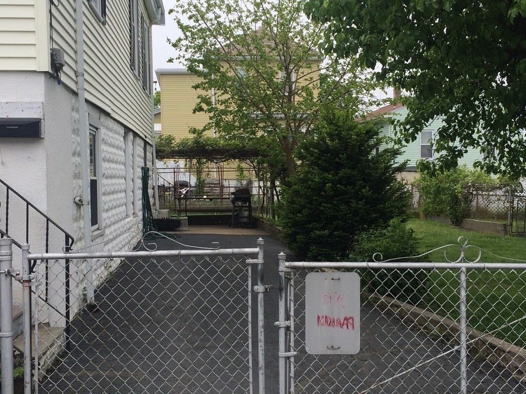 21 Beach Road Revere, MA 02151 - Photo 2 of 21 a view of a wooden fence and a trees