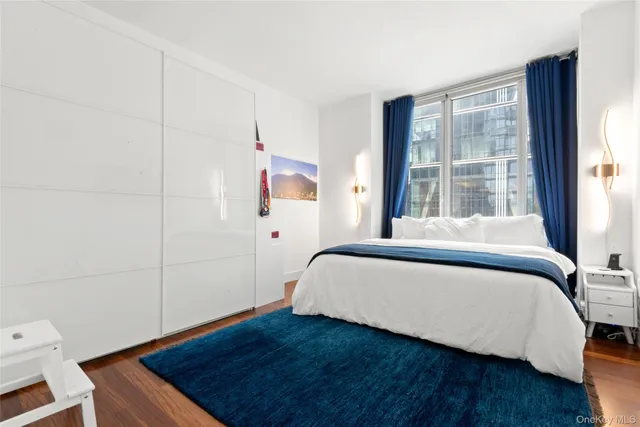 a living room with furniture a flat screen tv and a dining table