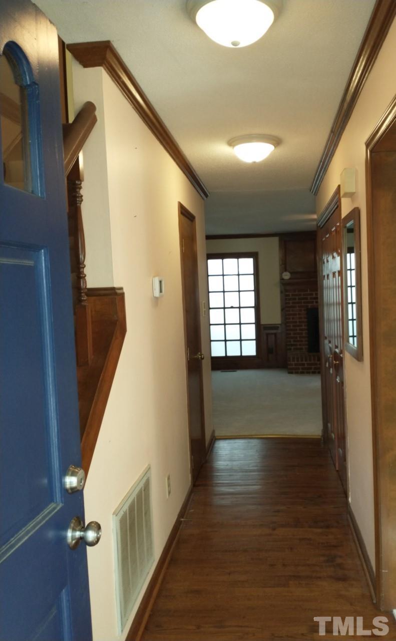 7300 Wilderness Road Raleigh, NC 27613 - Photo 2 of 15 a view of livingroom with furniture and wooden floor