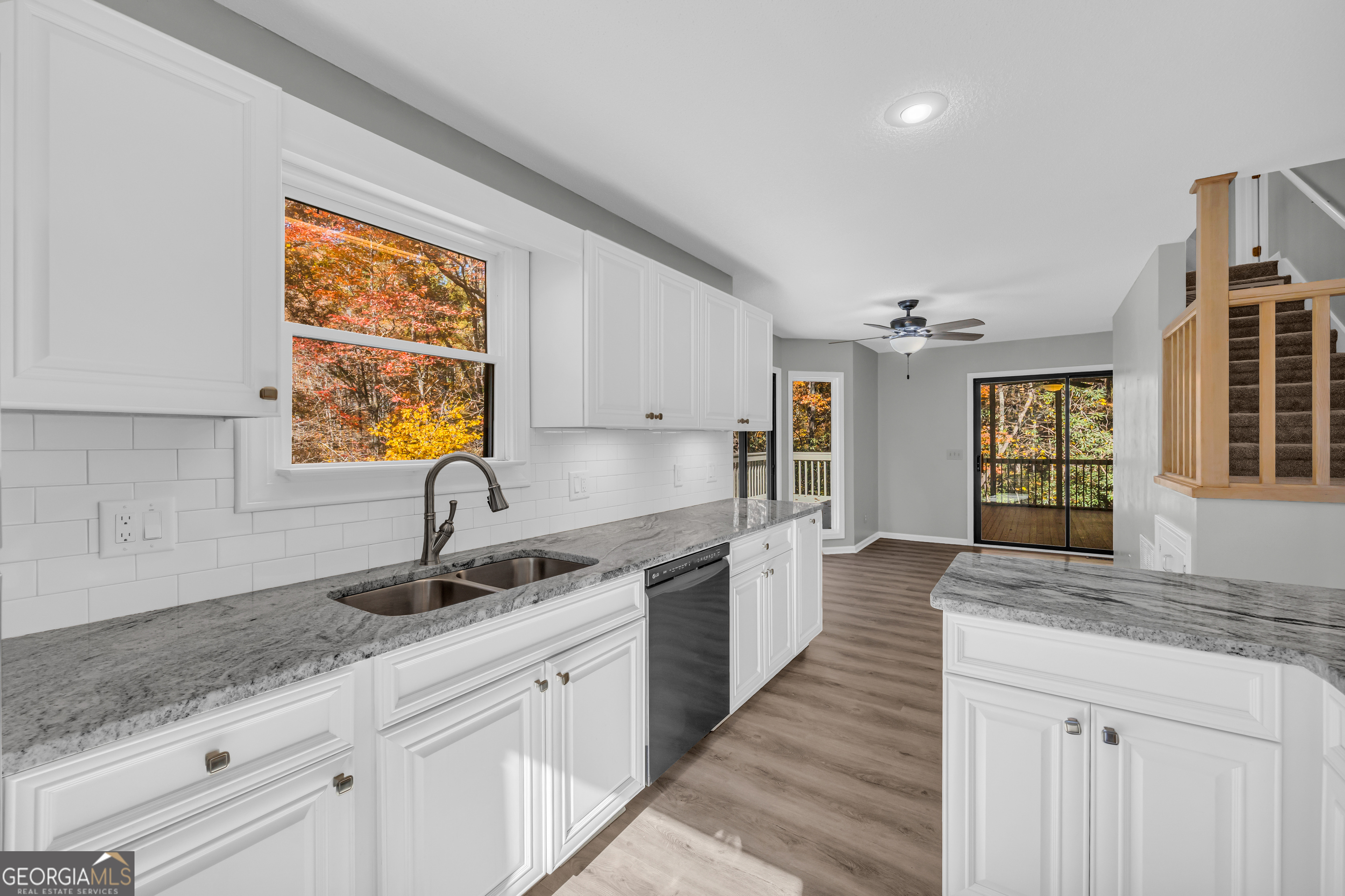 222 Blue Ridge Drive Sautee Nacoochee, GA 30571 - Photo 16 of 106 a kitchen with granite countertop a sink dishwasher stove and cabinets