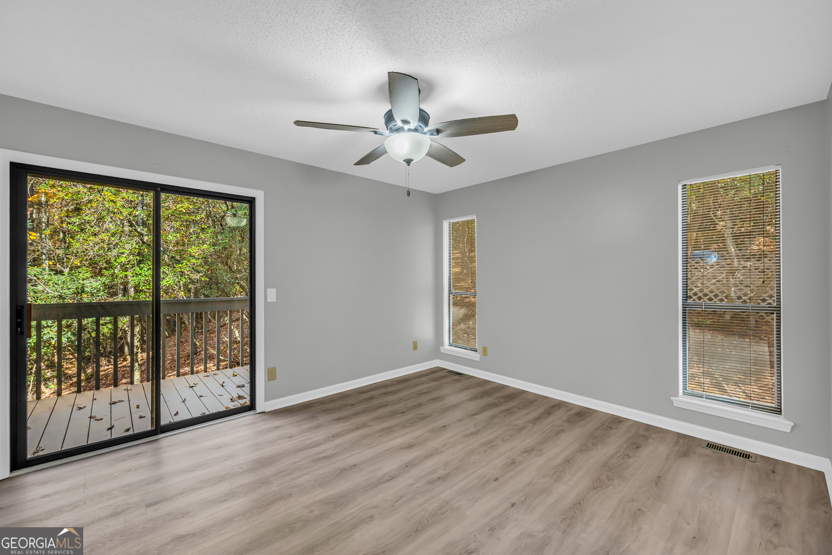 222 Blue Ridge Drive Sautee Nacoochee, GA 30571 - Photo 19 of 106 a view of an empty room with wooden floor and a window