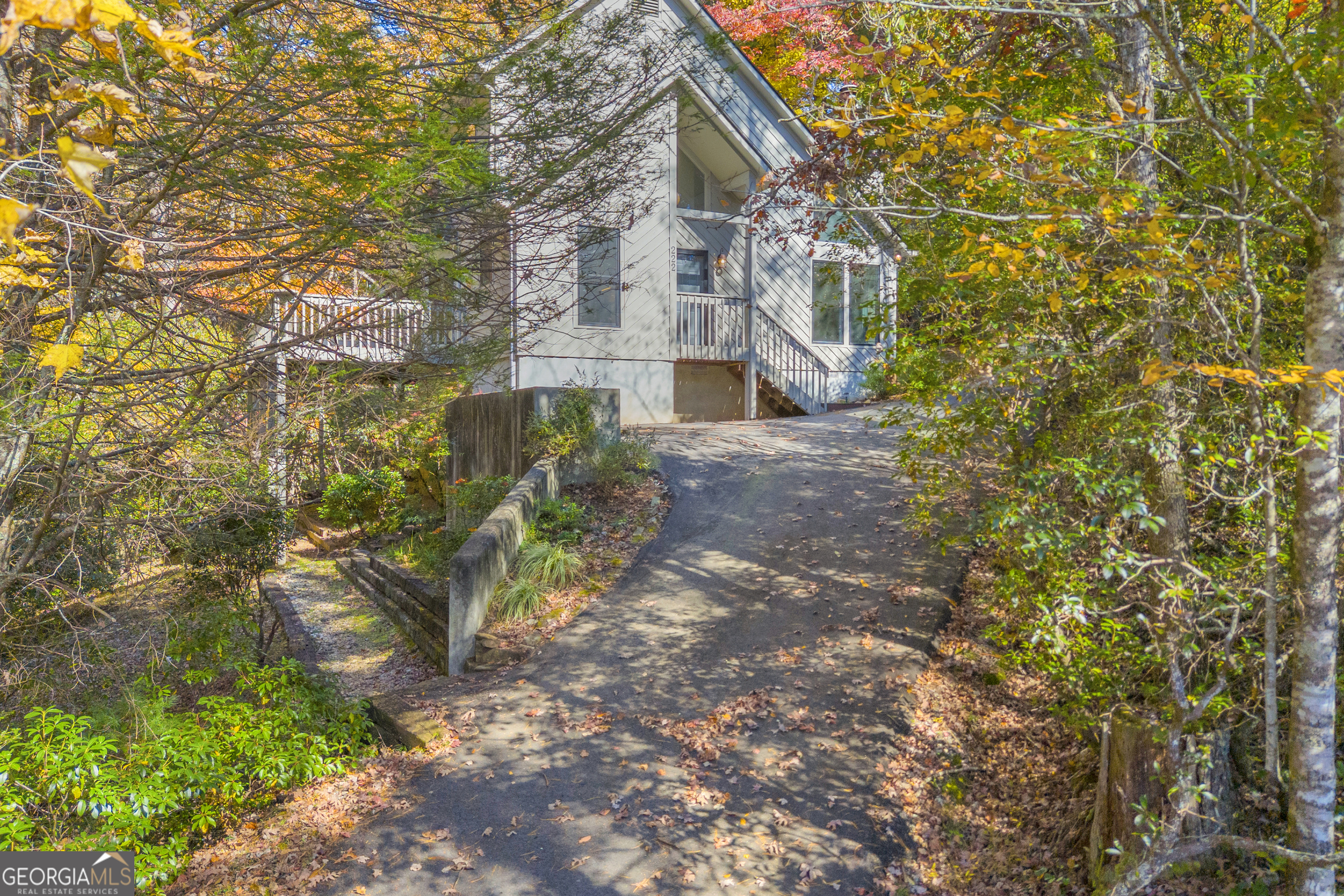 222 Blue Ridge Drive Sautee Nacoochee, GA 30571 - Photo 2 of 106 a view of a brick house with a yard