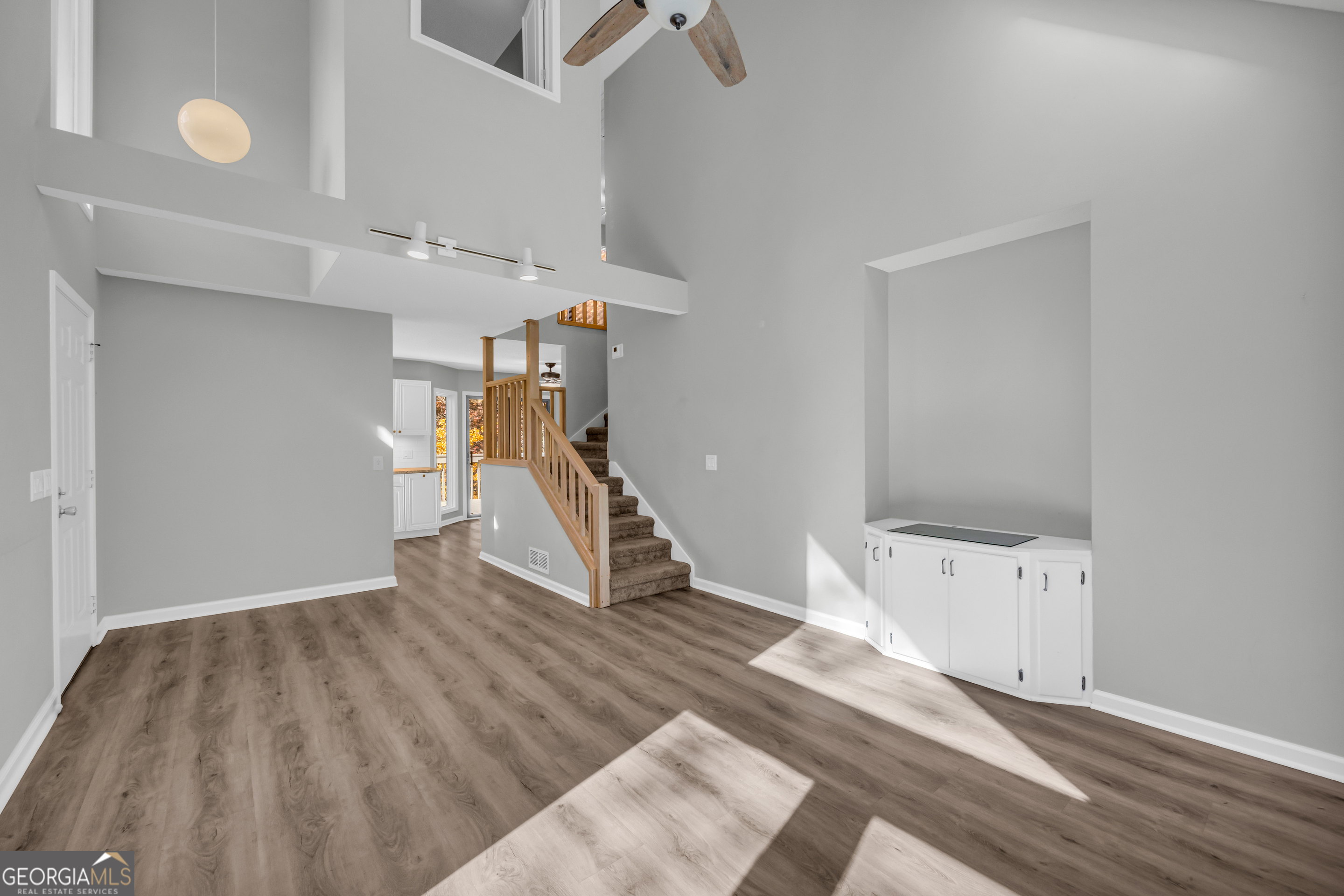 222 Blue Ridge Drive Sautee Nacoochee, GA 30571 - Photo 7 of 106 a view of an empty room with stairs and a ceiling fan