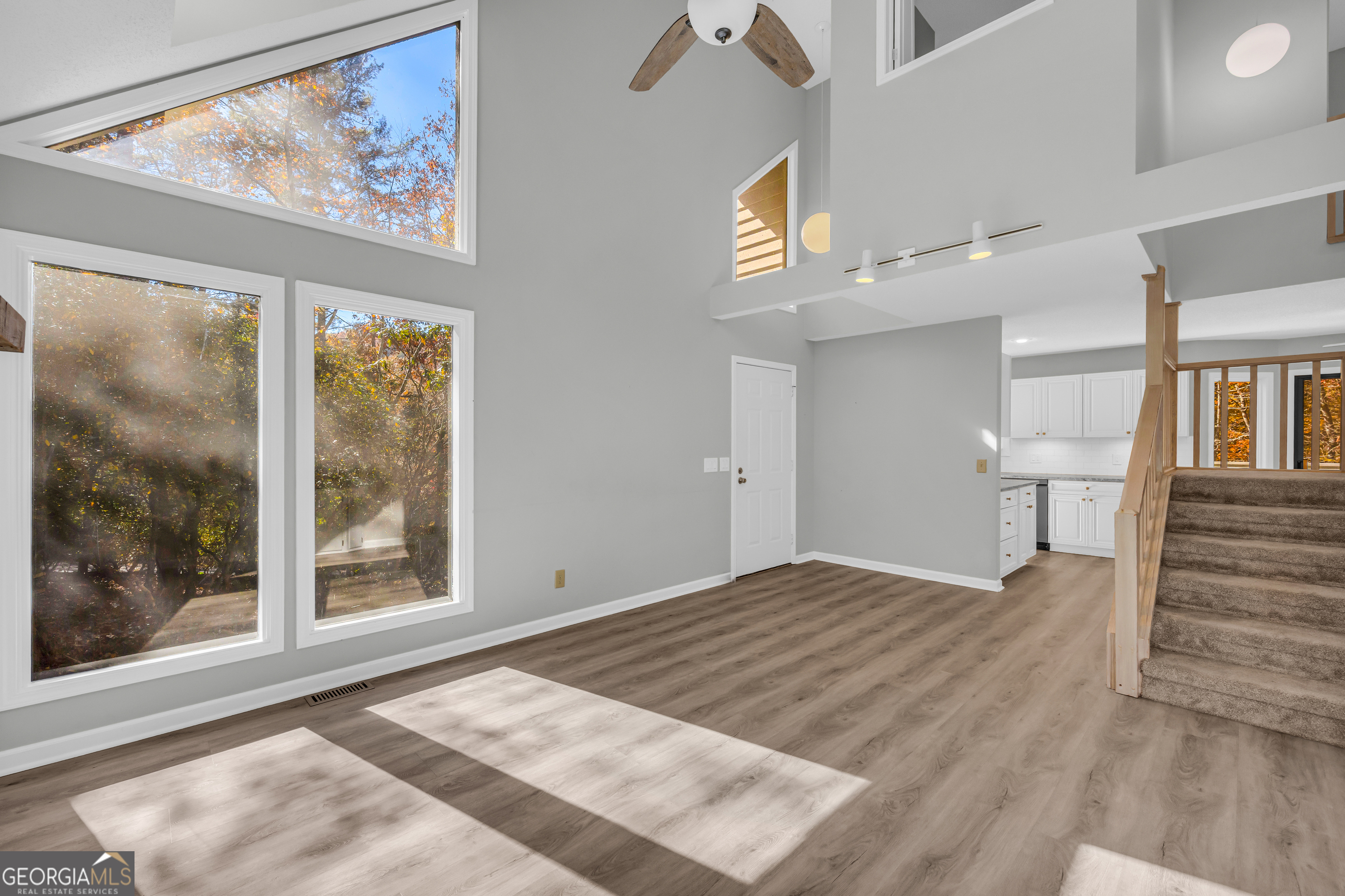 222 Blue Ridge Drive Sautee Nacoochee, GA 30571 - Photo 8 of 106 a view of an empty room with wooden floor and a window