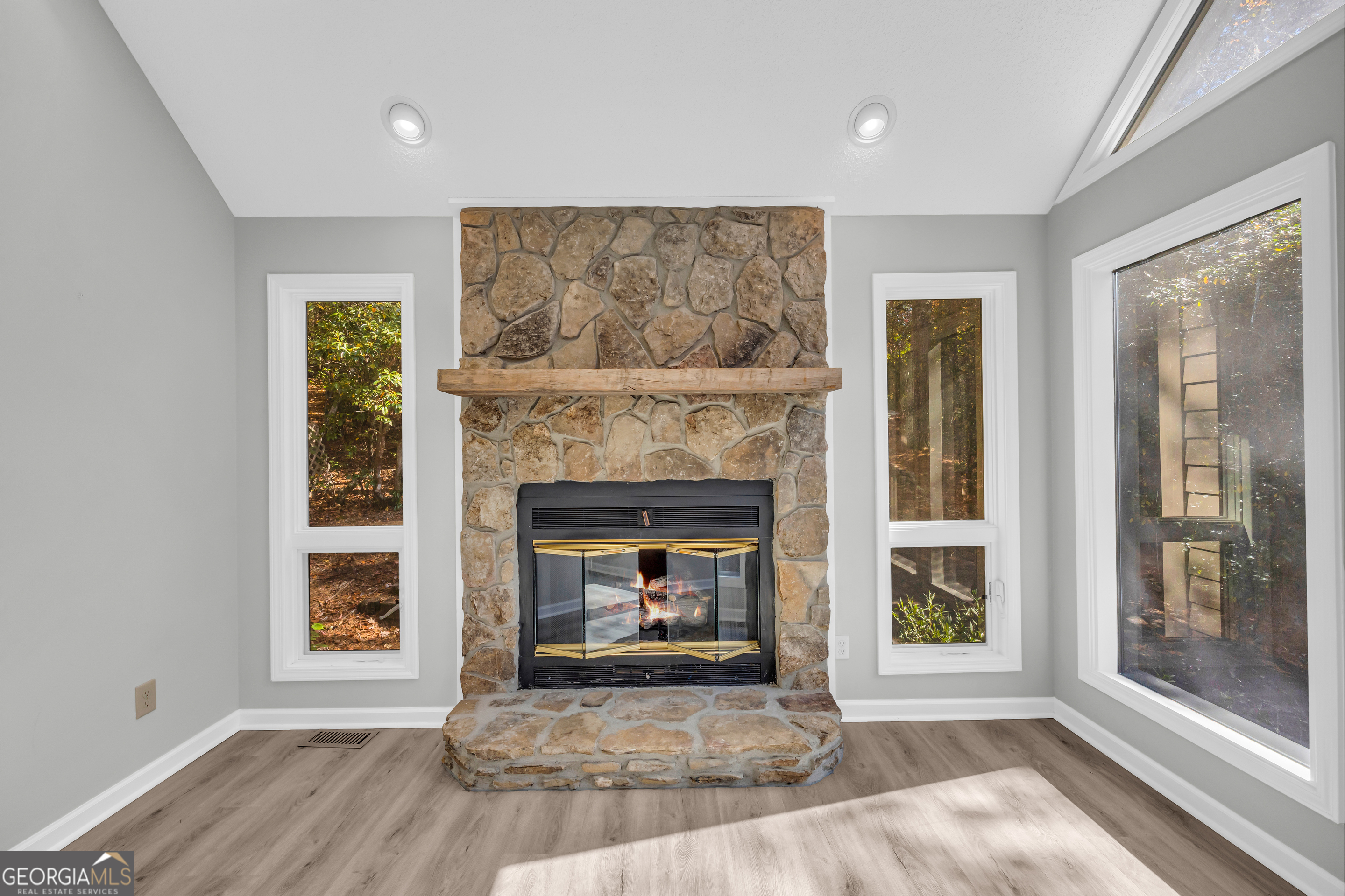 222 Blue Ridge Drive Sautee Nacoochee, GA 30571 - Photo 9 of 106 a view of an empty room with a fireplace and a window