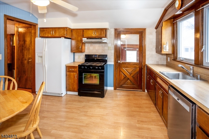 100 Troy Hills Road Whippany, NJ 07981 - Photo 13 of 37 a kitchen with stainless steel appliances granite countertop a stove a sink and a microwave