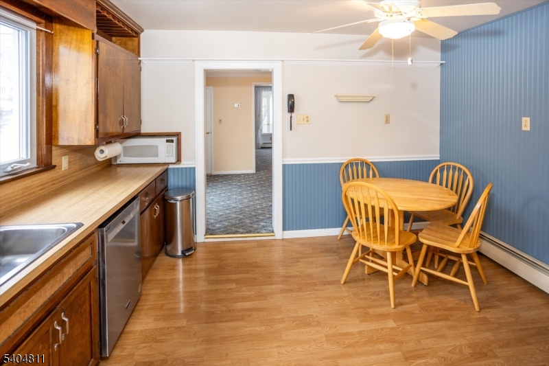 100 Troy Hills Road Whippany, NJ 07981 - Photo 14 of 37 a view of a kitchen area with furniture and wooden floor