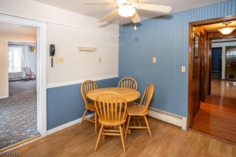 100 Troy Hills Road Whippany, NJ 07981 - Photo 15 of 37 a view of a dining room with furniture and wooden floor