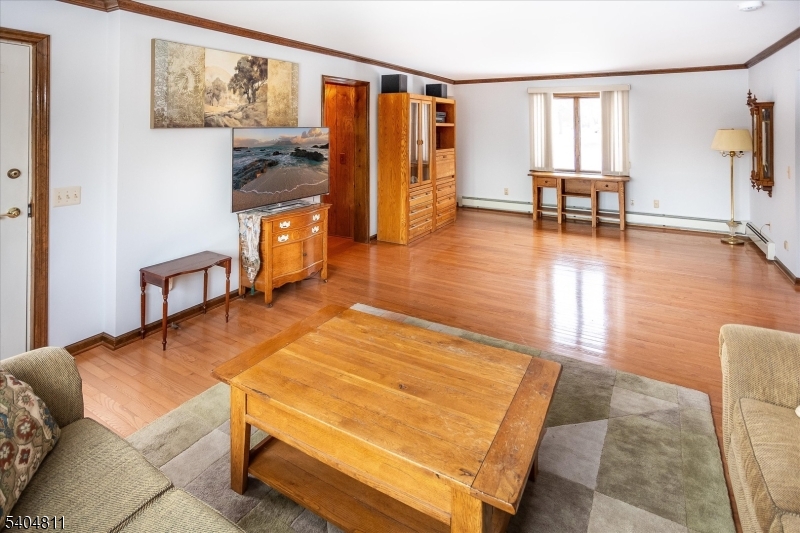 100 Troy Hills Road Whippany, NJ 07981 - Photo 20 of 37 a living room with furniture and a table