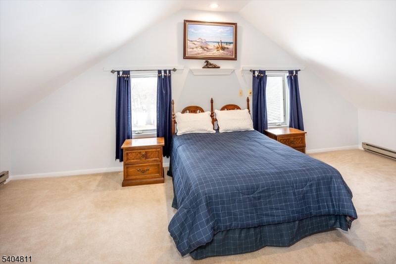 100 Troy Hills Road Whippany, NJ 07981 - Photo 21 of 37 a bedroom with a bed and dresser with window