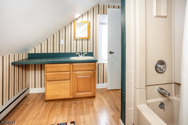 100 Troy Hills Road Whippany, NJ 07981 - Photo 23 of 37 a bathroom with a bathtub and a sink