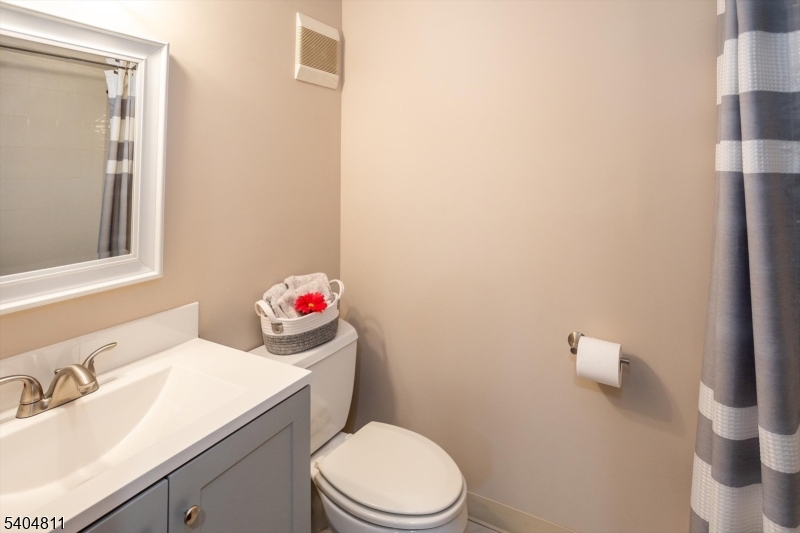 100 Troy Hills Road Whippany, NJ 07981 - Photo 32 of 37 a bathroom with a sink a toilet and a mirror